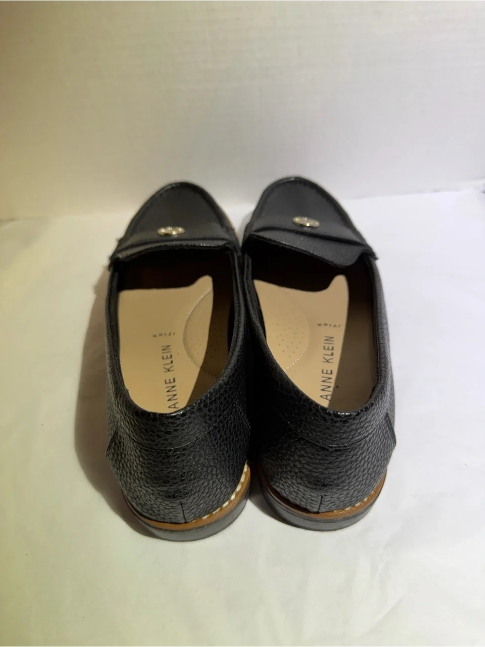 Anne Klein Black Textured Leather Loafers with Gold Emblem